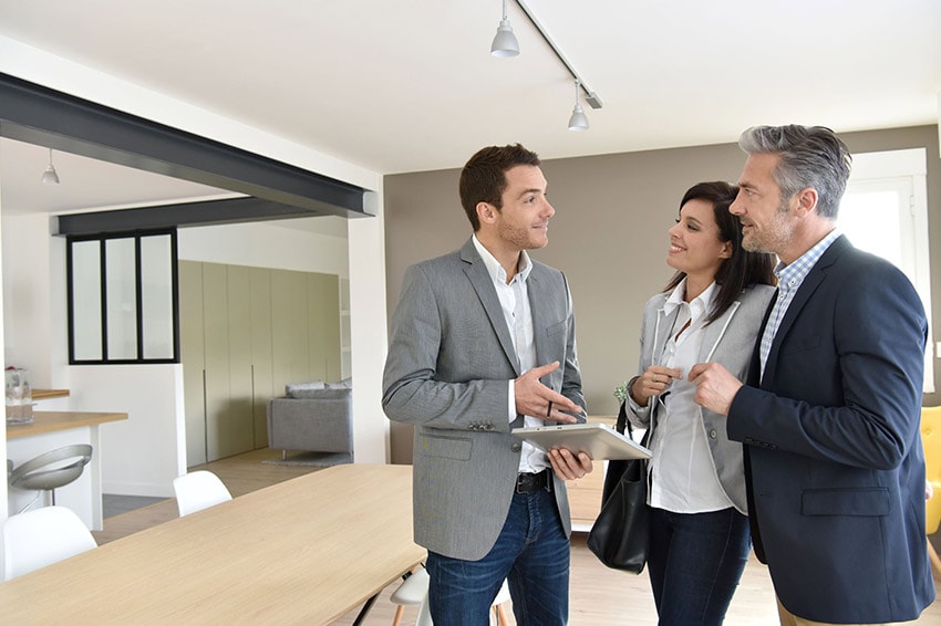 Investors look at property with property manager