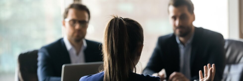 womans takes lead in meeting with two men
