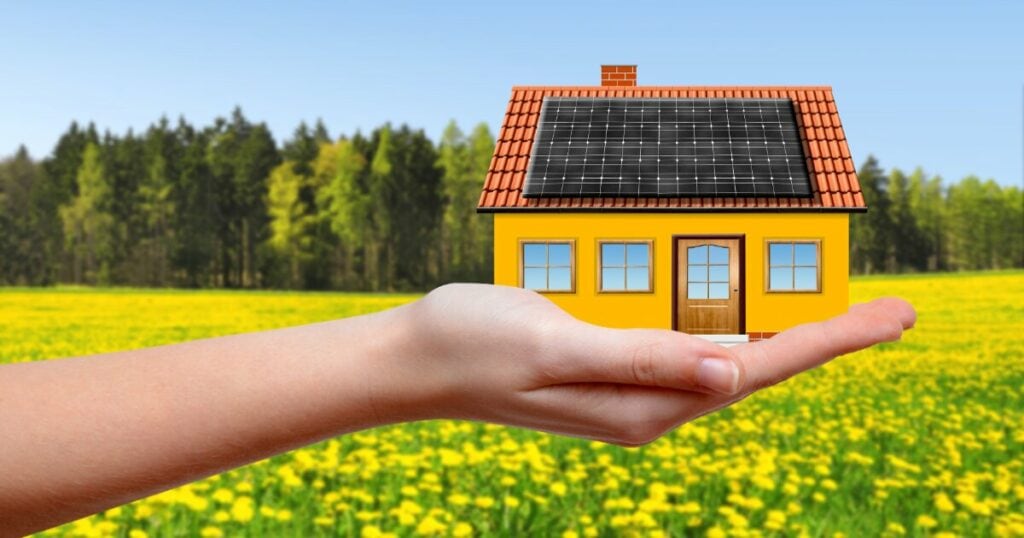 Solar Home in person's hand