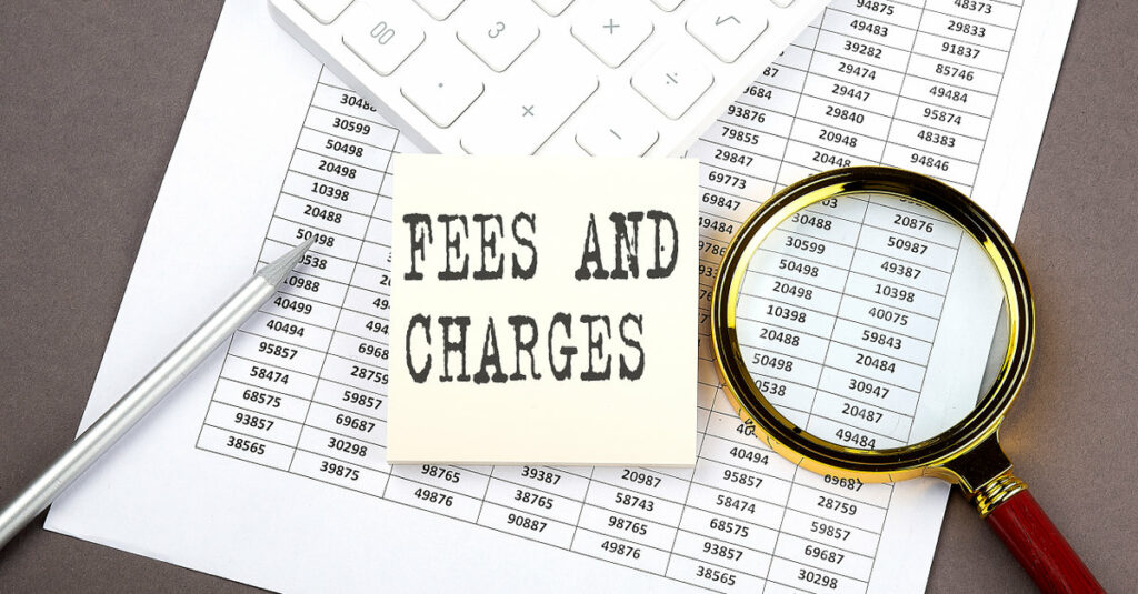 FEES AND CHARGES sticker text on top of chart with calculator and magnifying glass